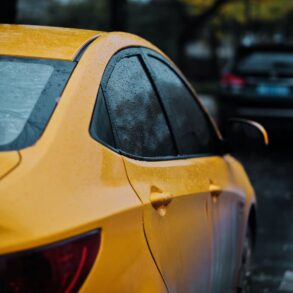 closeup photography of yellow car