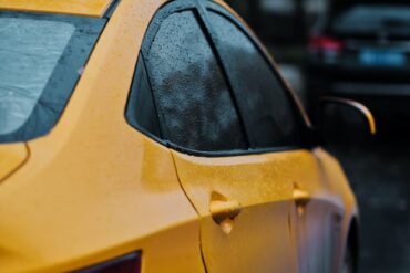 closeup photography of yellow car