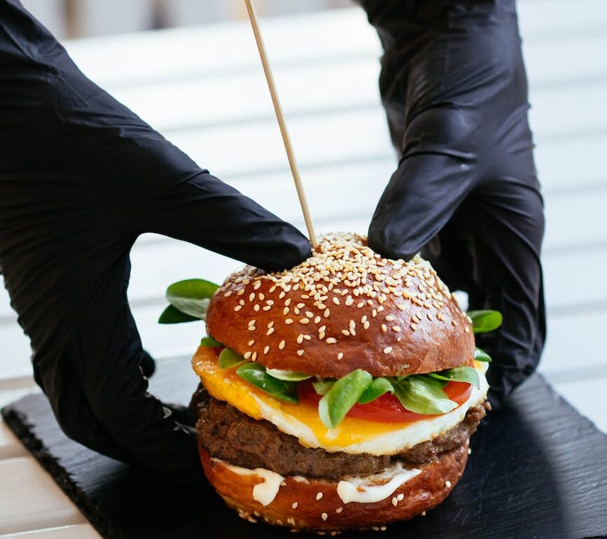 selective focus photography of skewed cheeseburger