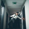 man break dancing on hallway